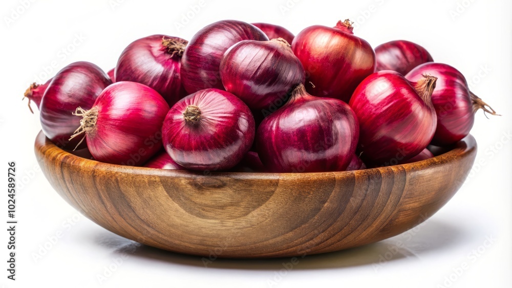 Vibrant red onions displayed in a charming wooden bowl on a pristine white background, showcasing their rich color and appealing texture. A perfect fresh produce image.
