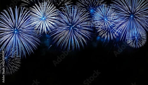 beautiful silver and blue fireworks on black background with copyspace for holiday use