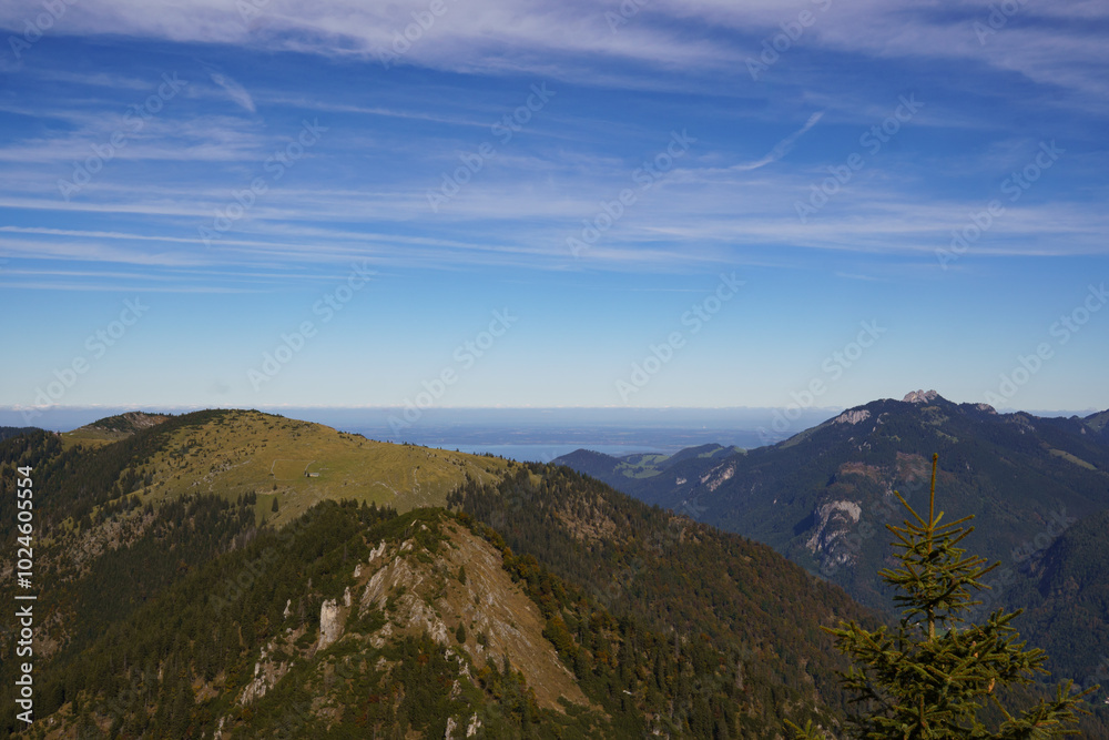 On the summit of the Spitzstein, a popular hiking mountain (Bavarian-Tyrolean border) with a view over the Chiemgau Alps and the Kampenwand to Lake Chiemsee On the summit of the Spitzstein, a popular hiking mountain (Bavarian-Tyrolean border) with a view over the Chiemgau Alps and the Kampenwand to Lake Chiemsee