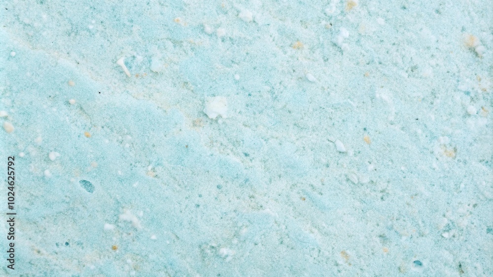 Fototapeta premium Smooth light blue stone surface background with pastel colors texture, close up