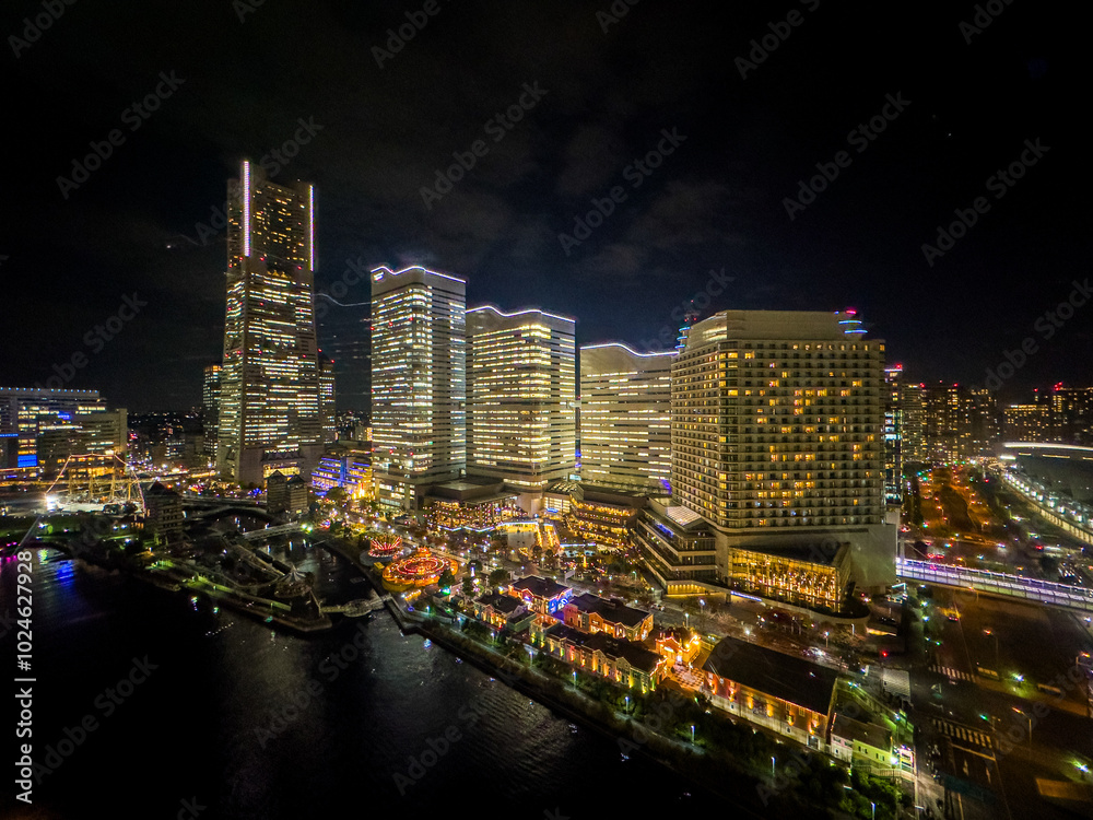 A breathtaking view of Yokohama's skyline at night ; Yokohama's cityscape illuminated by countless lights A breathtaking view of Yokohama's skyline at night ; Yokohama's cityscape illuminated by countless lights