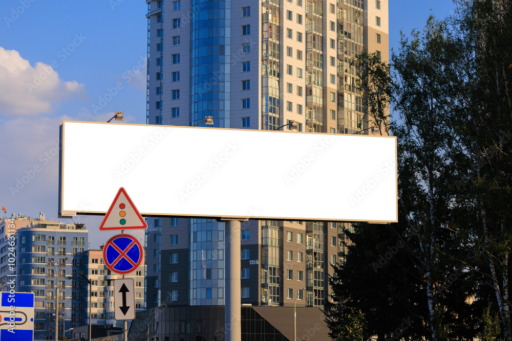 Background for design. Advertising billboard along the road in the city on a sunny day