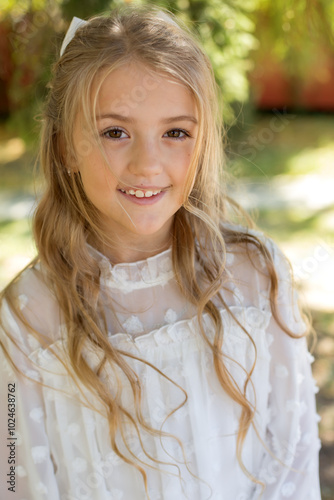 a girl wearing a white dress with white polka dots on it