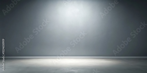 A single spotlight illuminates an empty room, showcasing the textured concrete floor and the plain gray wall.