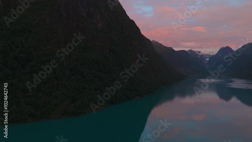 Oldevatnet lake at Briksdalsbreen glacier. Norway Scandinavia nature sunset sky water reflection photo
