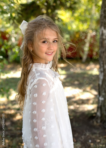 a girl wearing a white dress with white polka dots on it