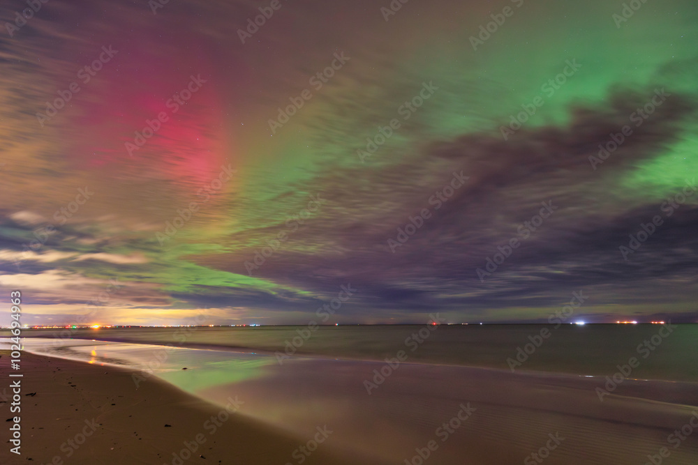 Northern lights over the Baltic Sea beach by the Sobieszewo Island, Gdansk. Poland. Northern lights over the Baltic Sea beach by the Sobieszewo Island, Gdansk. Poland.