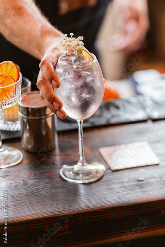 a bartender makes a cocktail. a bartender makes an alcoholic refreshing summer cocktail