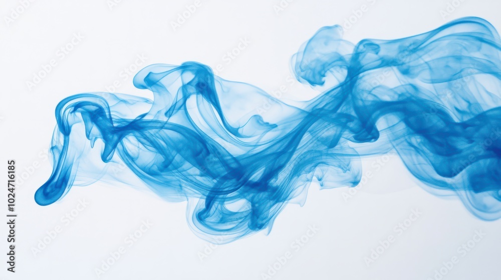 Blue smoke forming abstract, fluid shapes as it explodes mid-air, captured on a white background.