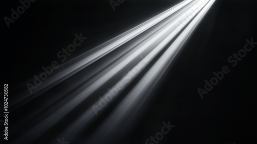 White light beam on a black background, with light from the side, a spotlight, and light streaks and rays