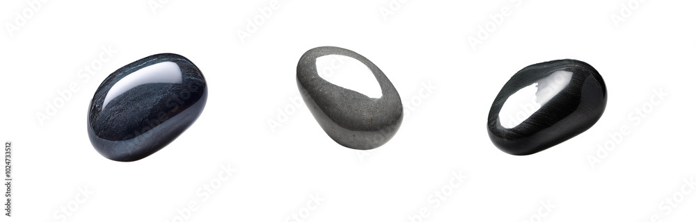 Three smooth, isolated stones of different shades of gray. Three smooth, isolated stones of different shades of gray.
