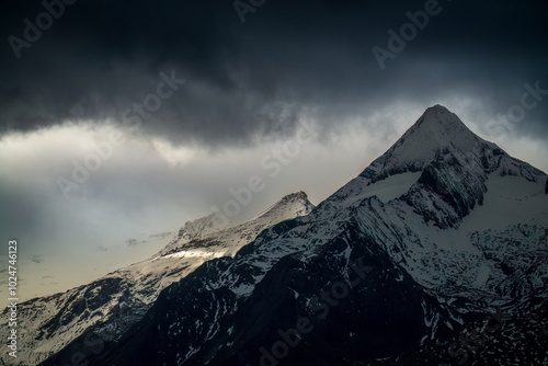 magical landscape of the austrian alps at a stormy autumn day photo