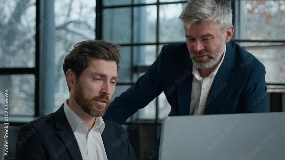 Caucasian men businessmen business partners looking computer screen in office coworkers argue shout because failed online project angry aggressive stressed man boss arguing with male employee conflict Caucasian men businessmen business partners looking computer screen in office coworkers argue shout because failed online project angry aggressive stressed man boss arguing with male employee conflict