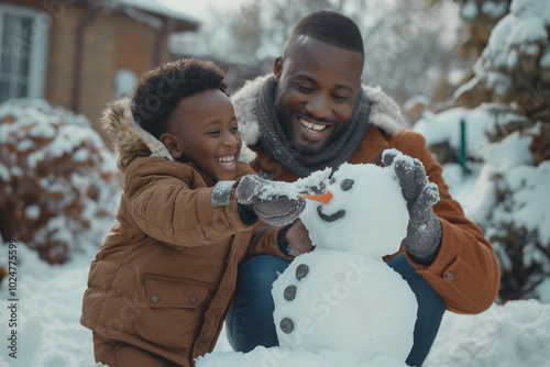 Joyful scene of an African American dad and son creating a snowman together in the backyard, capturing the fun of winter activities photo