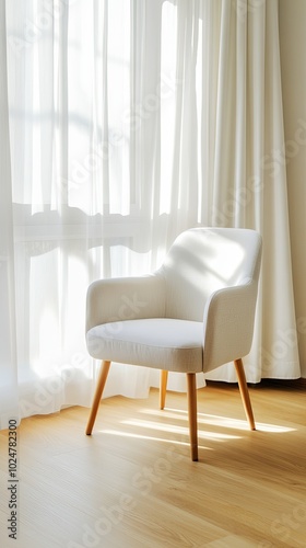 This modern living room features a stylish gray armchair made of beige leather, complemented by wooden legs, inviting relaxation in a sunlit space with greenery