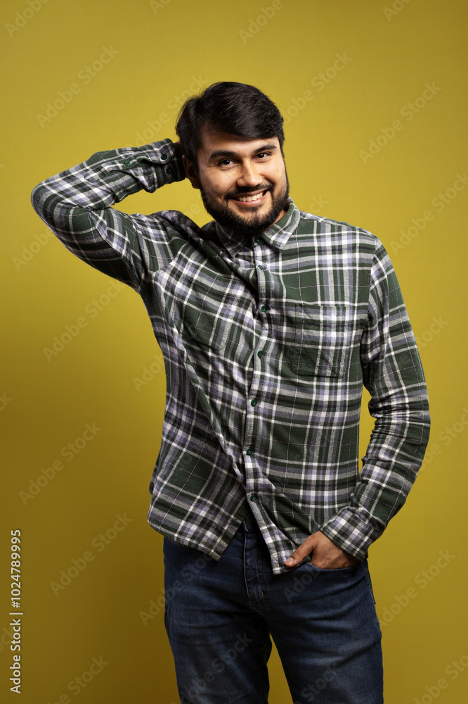 man smiling with one hand in his pocket and the other behind his head man smiling with one hand in his pocket and the other behind his head