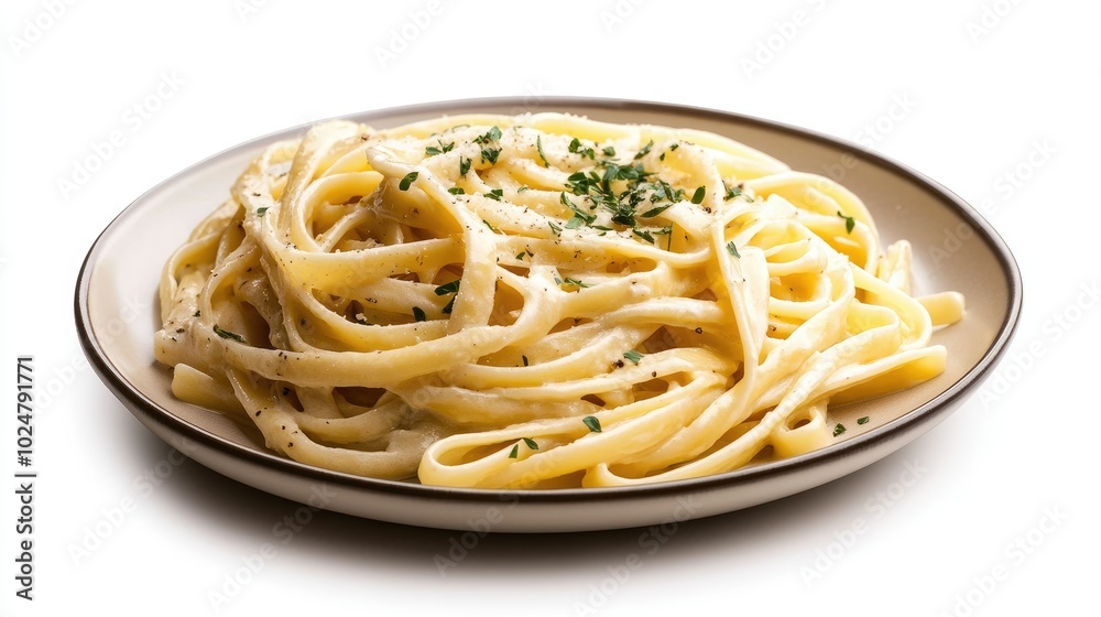 A beautifully styled plate of fettuccine Alfredo, rich in creamy sauce and sprinkled with fresh herbs, isolated on a white background to highlight the inviting colors and textures of the dish. A beautifully styled plate of fettuccine Alfredo, rich in creamy sauce and sprinkled with fresh herbs, isolated on a white background to highlight the inviting colors and textures of the dish.