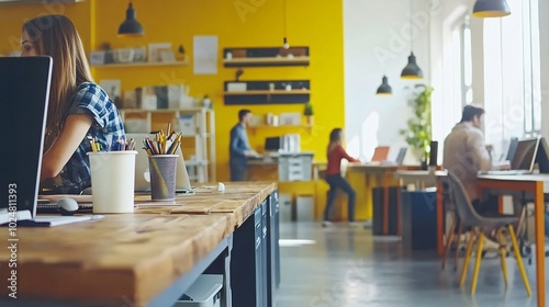 Professionals in a co-working space engaged in independent work while sharing a common area Stock Photo with side copy space