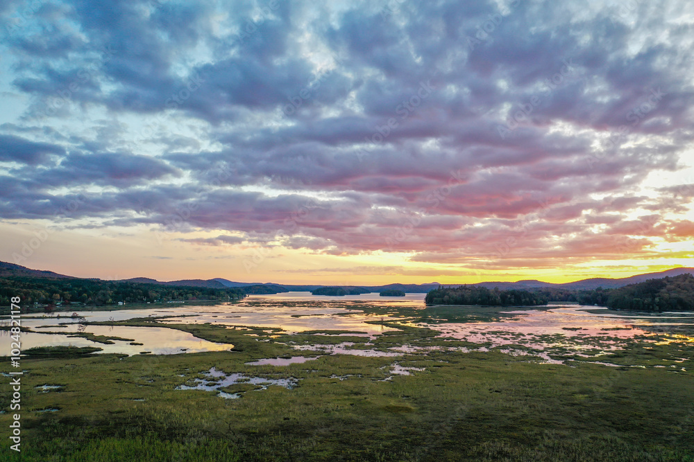 Naklejka premium Tupper Lake NY Adirondacks Tri Lakes Region majestic sunset in fall aerial