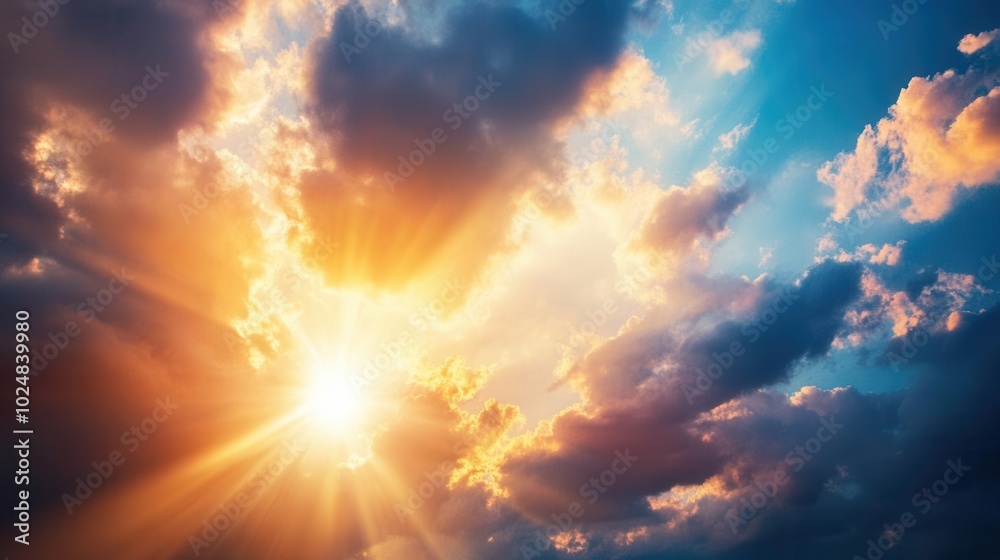 Dramatic sunset sky with golden rays and clouds Dramatic sunset sky with golden rays and clouds