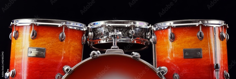 Orange and Yellow Drum Set Isolated on Black Background, Musical Instrument, Percussion. Orange and Yellow Drum Set Isolated on Black Background, Musical Instrument, Percussion.
