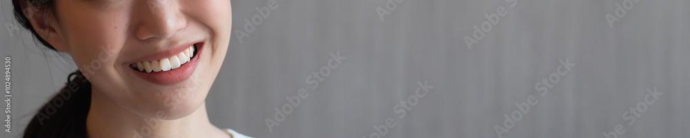 Fototapeta premium Woman with crooked teeth, concept image for mouth care, dental care, malocclusion or bad bites, minor teeth misalignment, overlapping tooth, uneven tooth of young adult woman
