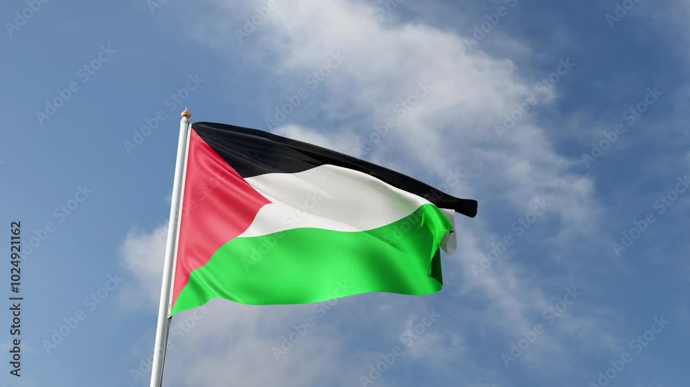 Flag of Palestine on a blue sky, flag on a flag pole waving in the wind ...