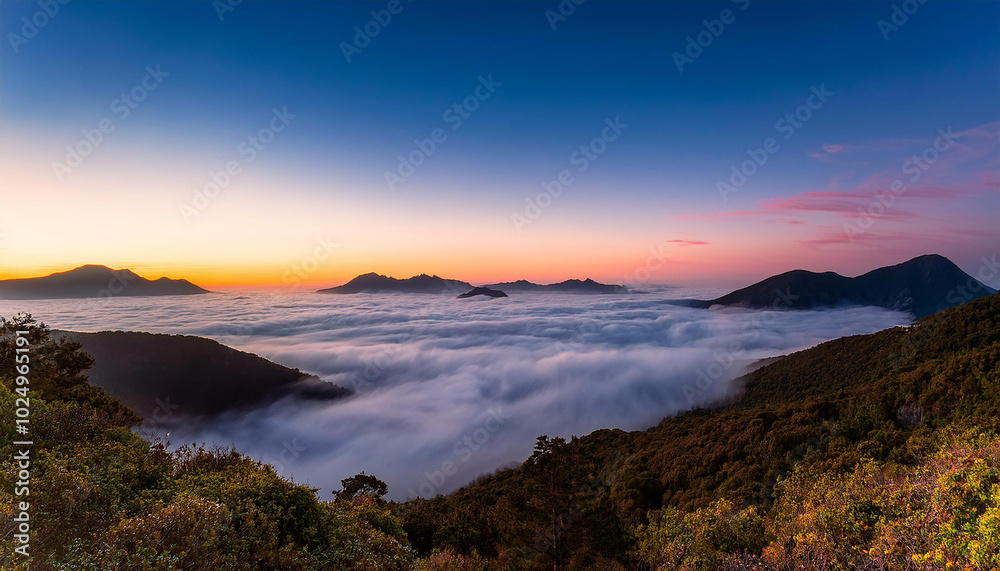 Fototapeta premium Ocean at Twilight with a view of cloud inversion and mountains