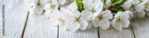 A delicate arrangement of white flowers on a wooden surface, evoking tranquility and beauty.