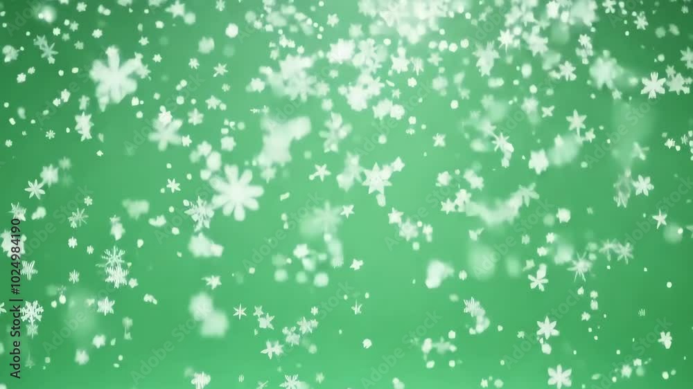 Delicate white snowflakes falling gracefully against a soothing green background on the green screen, the chromakey