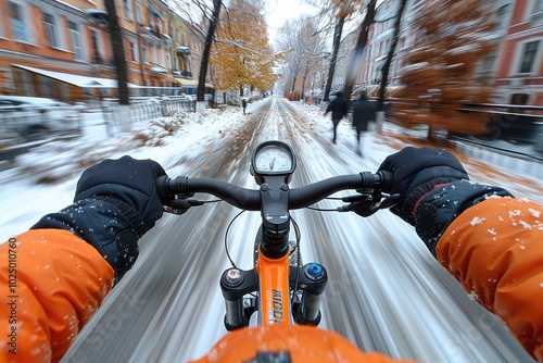 First-Person View of a Cyclist Riding Through a Snowy City Street photo