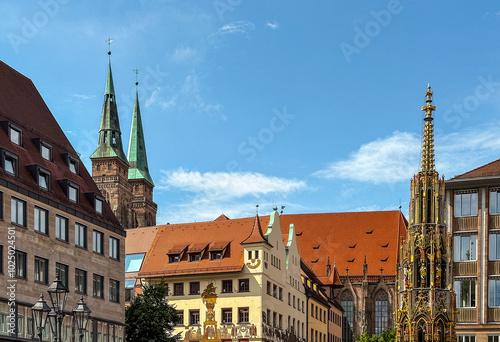 Schoner Brunnen ancient fountain and Frauenkirche Church at Hauptmarkt main square photo