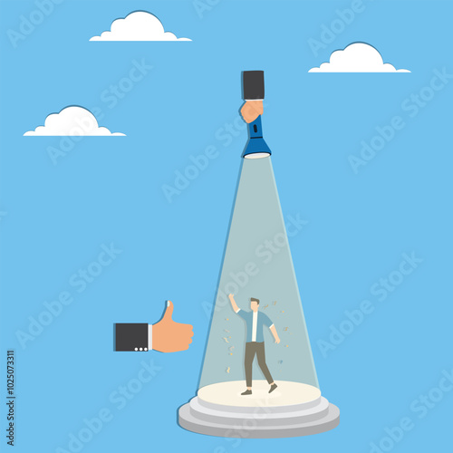 Thumbs up for businessman in spotlight