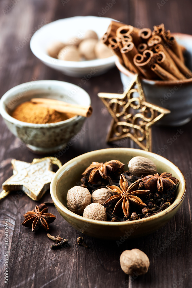 Star anise with cinnamon. Christmas spices on rustic wooden background. Close up.