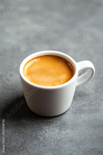 Cup of espresso on a dark surface