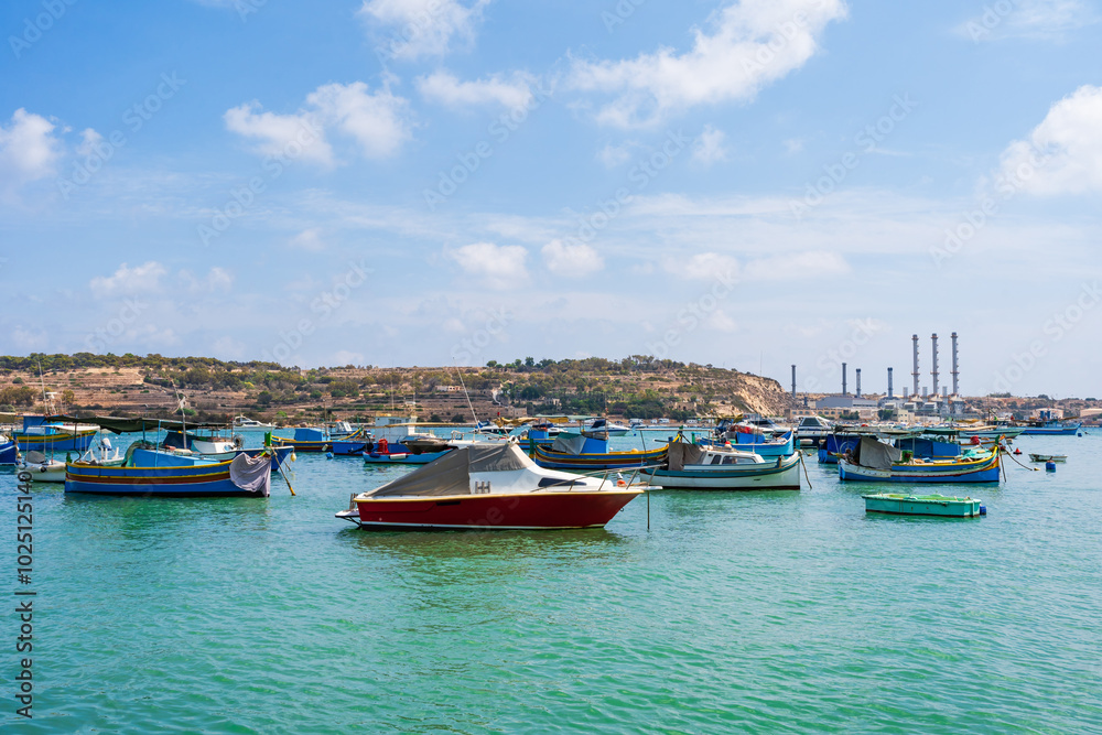 View of Marsaxlokk harbour with traditional colourful fishing boats in Malta View of Marsaxlokk harbour with traditional colourful fishing boats in Malta