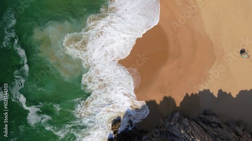 Wallpaper Mural Topdown aerial drone footage of a white sand beach with crashing ocean waves and rock on a clear summer day Torontodigital.ca