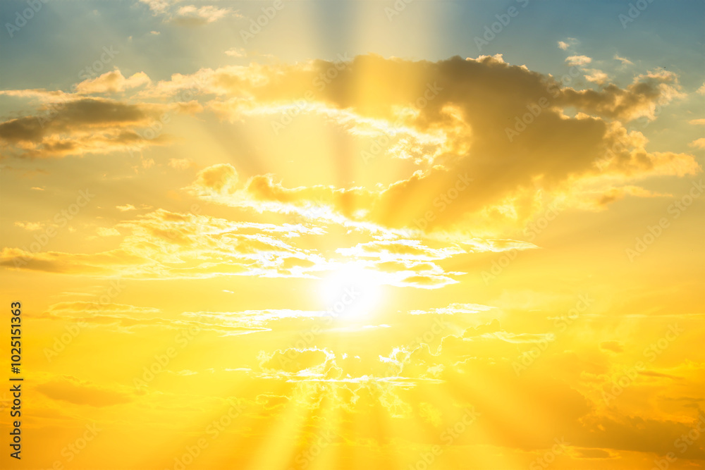 Sunset sky background with sun and sunset clouds