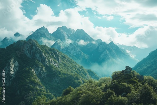 A landscape view of a mountain range from a distance with varying levels of terrain and texture