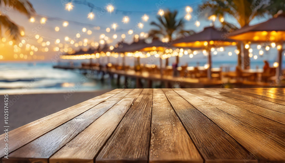 Beautiful beachside wooden table overlooking a stunning pier with glowing lights during sunset Beautiful beachside wooden table overlooking a stunning pier with glowing lights during sunset