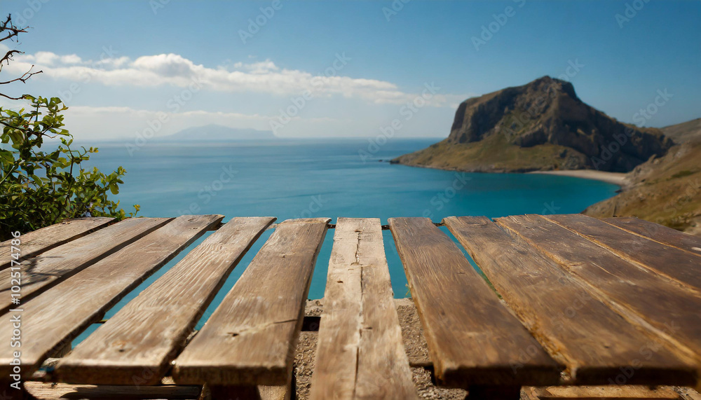 Scenic view from a wooden table overlooking the tranquil sea and rocky coastline on a sunny day Scenic view from a wooden table overlooking the tranquil sea and rocky coastline on a sunny day