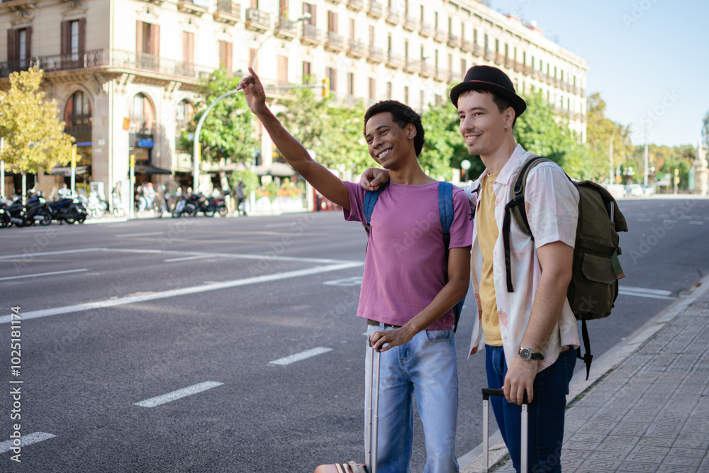 Obraz premium A multiethnic couple of two young men stand on the street raising their hands to hail a cab.