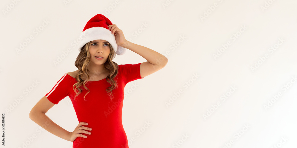 Puzzled preoccupied young brunette Santa woman wearing red dress, Christmas hat put hand on head isolated on white background, studio portrait. Happy New Year holiday concept Puzzled preoccupied young brunette Santa woman wearing red dress, Christmas hat put hand on head isolated on white background, studio portrait. Happy New Year holiday concept