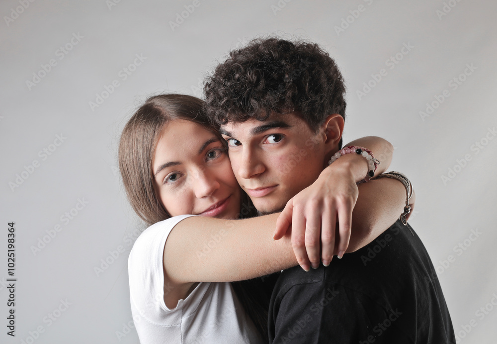 portrait of young couple embracing portrait of young couple embracing