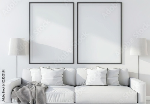 Minimalist living room interior with a white sofa and two blank black picture frames on the wall above it. This design provides copyspace for adding your own art photo