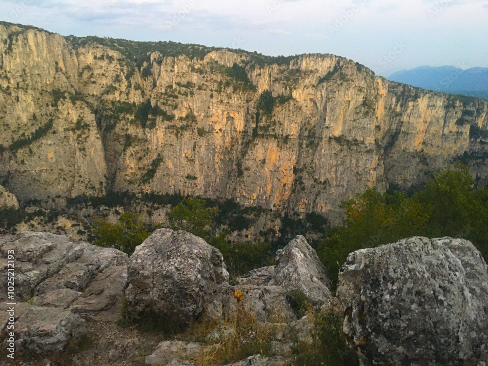 Nature in the mountains. Vikos Gorge from the viewpoint of Oxi in the national park in Vikos-Aoos in Zagori, northern Greece. Natural landscape Nature in the mountains. Vikos Gorge from the viewpoint of Oxi in the national park in Vikos-Aoos in Zagori, northern Greece. Natural landscape