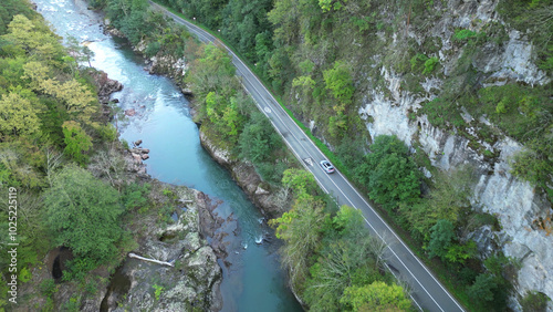 view from the copter to the mountain river and highway. Autumn landscape
