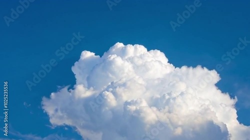 Fast-moving white clouds against the blue sky.
