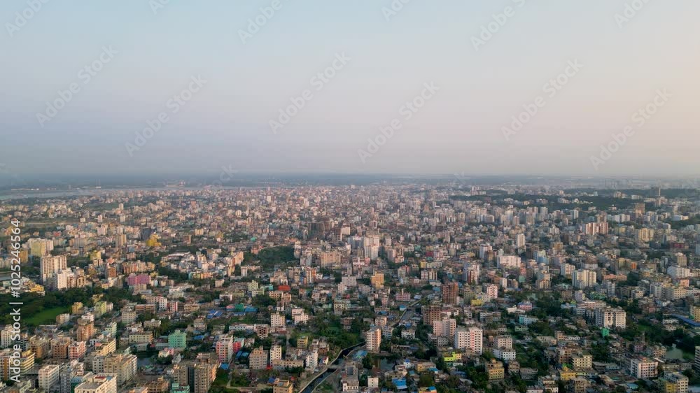 Aerial view of the densely populated and unplanned cityscape of Chittagong, Bangladesh. The city is packed with buildings of various sizes, crisscrossed by narrow streets Aerial view of the densely populated and unplanned cityscape of Chittagong, Bangladesh. The city is packed with buildings of various sizes, crisscrossed by narrow streets