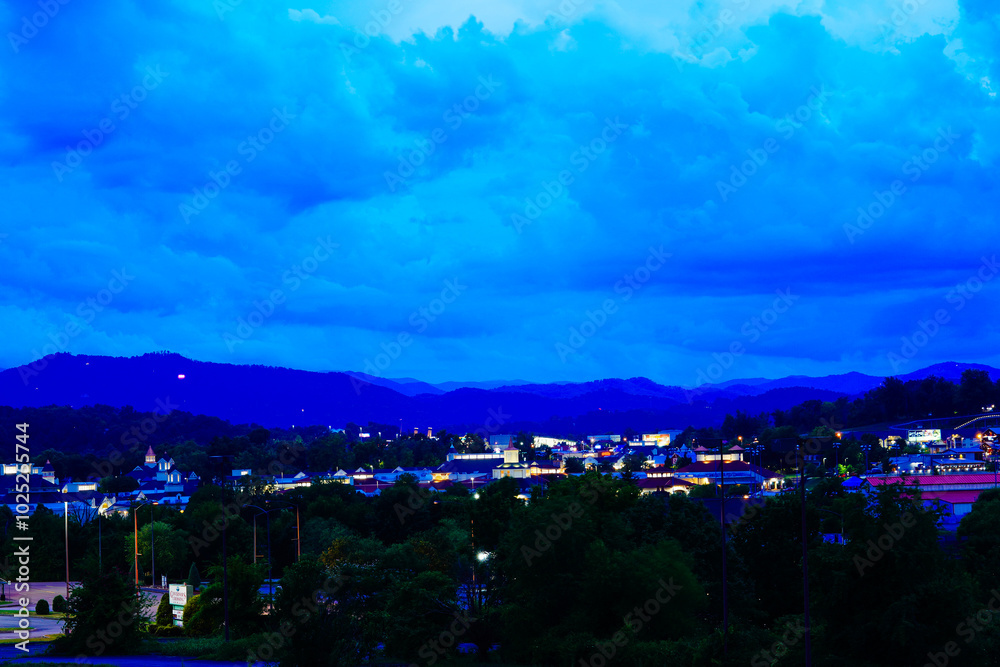 Fototapeta premium Sevierville, Tennessee, USA 07 25 2024: Night landscape of Sevierville and Pigeon Forge and great smoky mountain national park